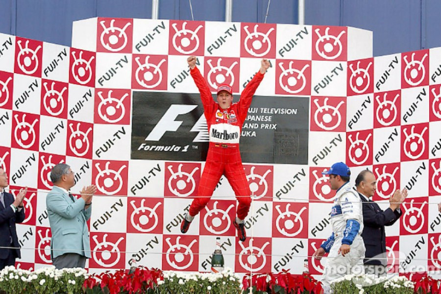 Michael Schumacher celebrates his victory in the 2001 Japanese Grand Prix